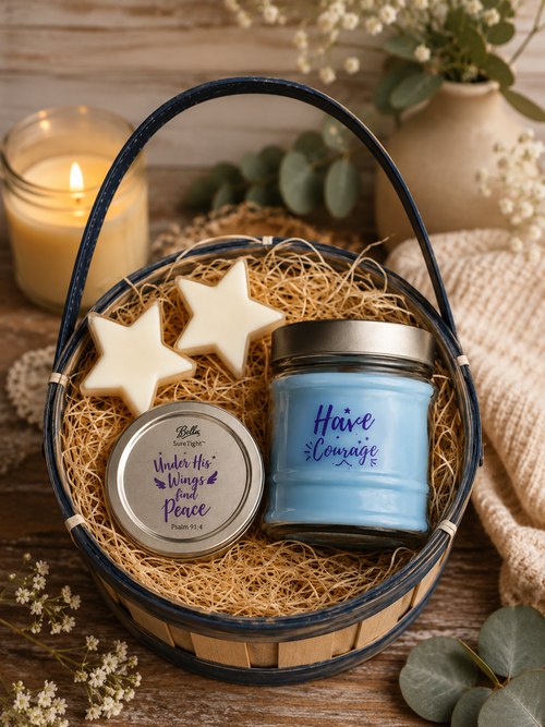 Inspirational candle gift basket featuring a "Have Courage" candle, scripture candle tin, star-shaped wax melts, and decorative reusable basket from Warm Glow Candle Co.