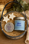 Inspirational candle gift basket featuring a "Have Courage" candle, scripture candle tin, star-shaped wax melts, and decorative reusable basket from Warm Glow Candle Co.